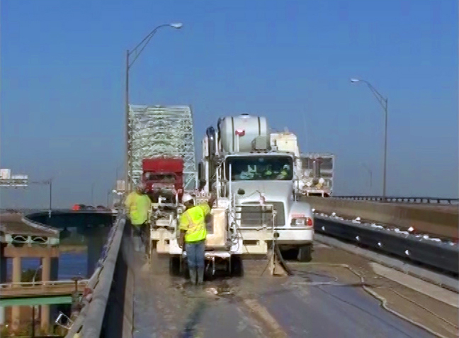 two men working at a truck